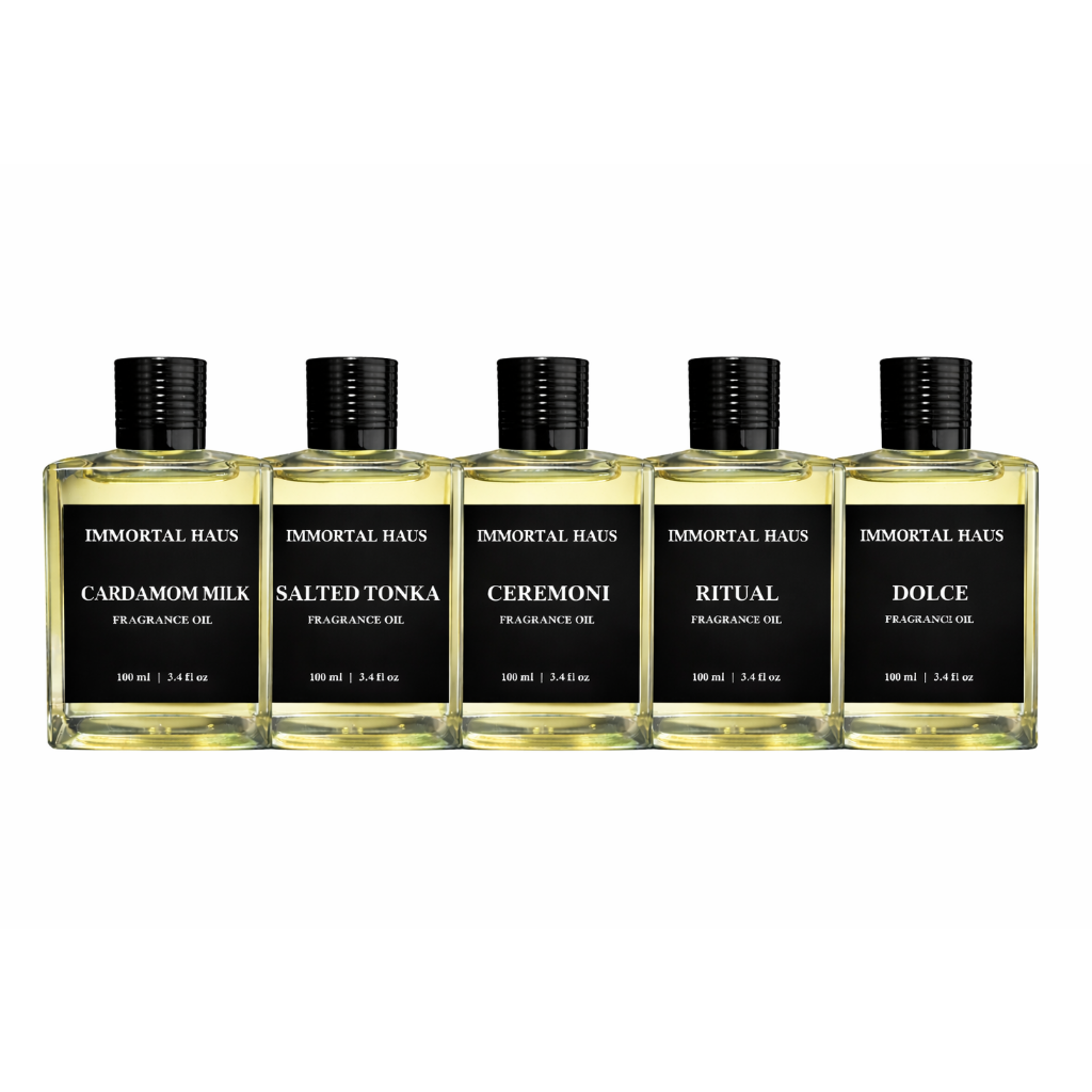 Five bottles of Immortal Haus fragrance oils on a white background