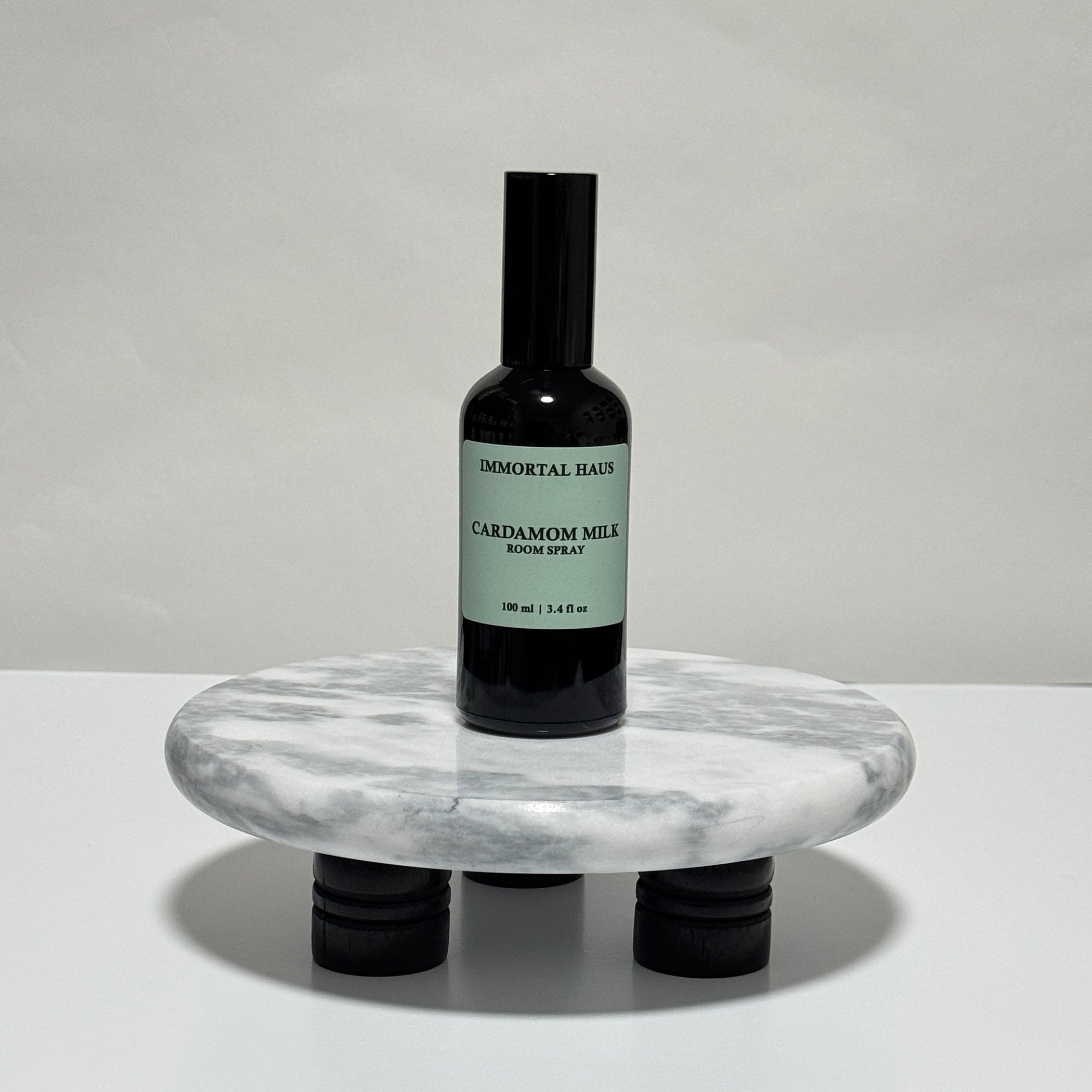 Cardamom Milk room and linen spray in black glass bottle, black cardamom, tonka bean, and vanilla scent, 3.4oz