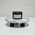 Cardamom Milk travel candle in charcoal gray tin, vanilla and cinnamon scent, 6.3 oz single wick
