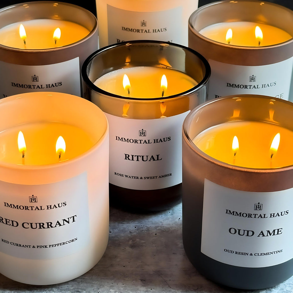 Build Your Own Candle Set – white matte, grey matte, and translucent Immortal Haus candles arranged together in a minimalist luxury setting.