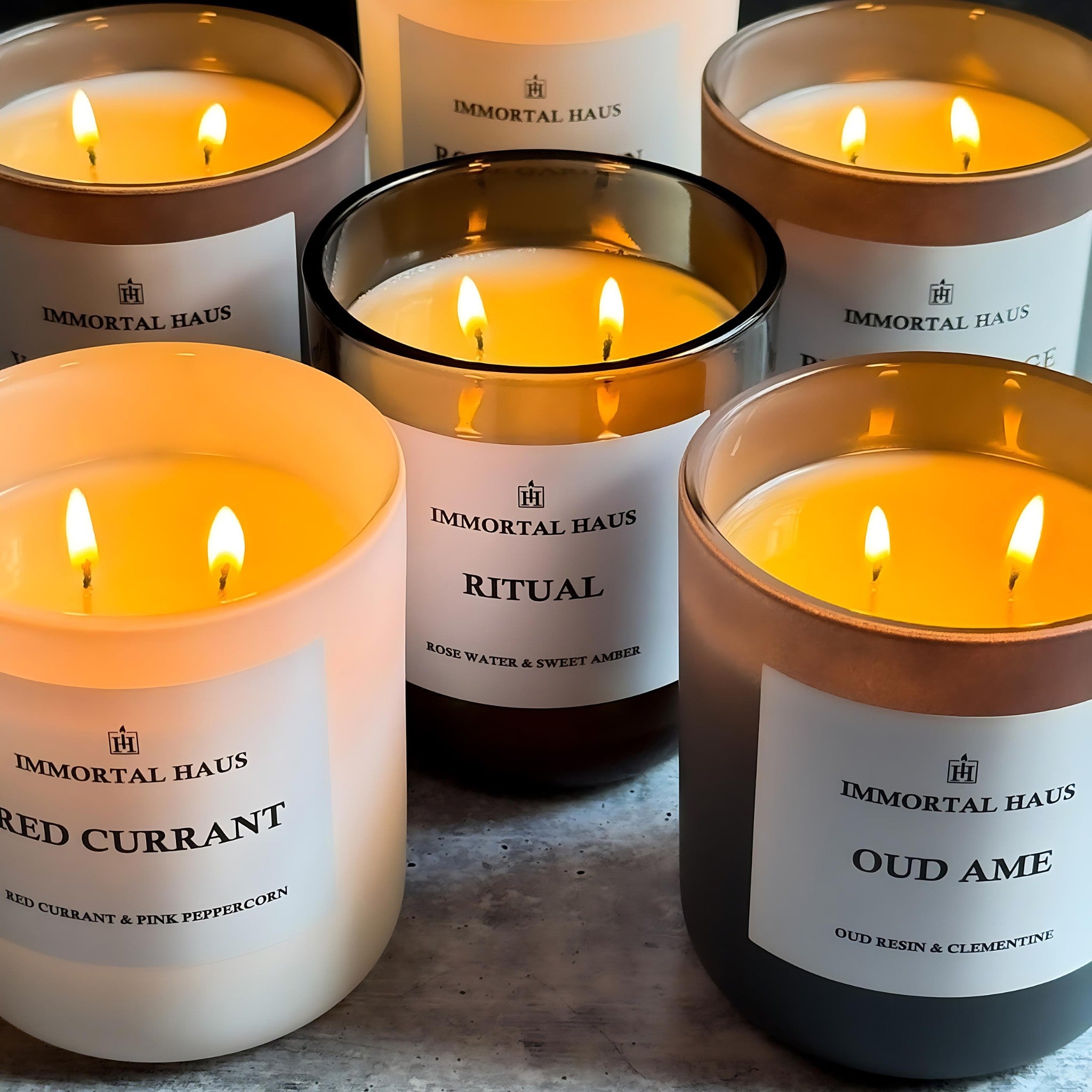 Build Your Own Candle Set – white matte, grey matte, and translucent Immortal Haus candles arranged together in a minimalist luxury setting.