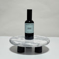 Origin room and linen spray in black glass bottle, peppermint, eucalyptus, and coconut milk scent, 3.4oz