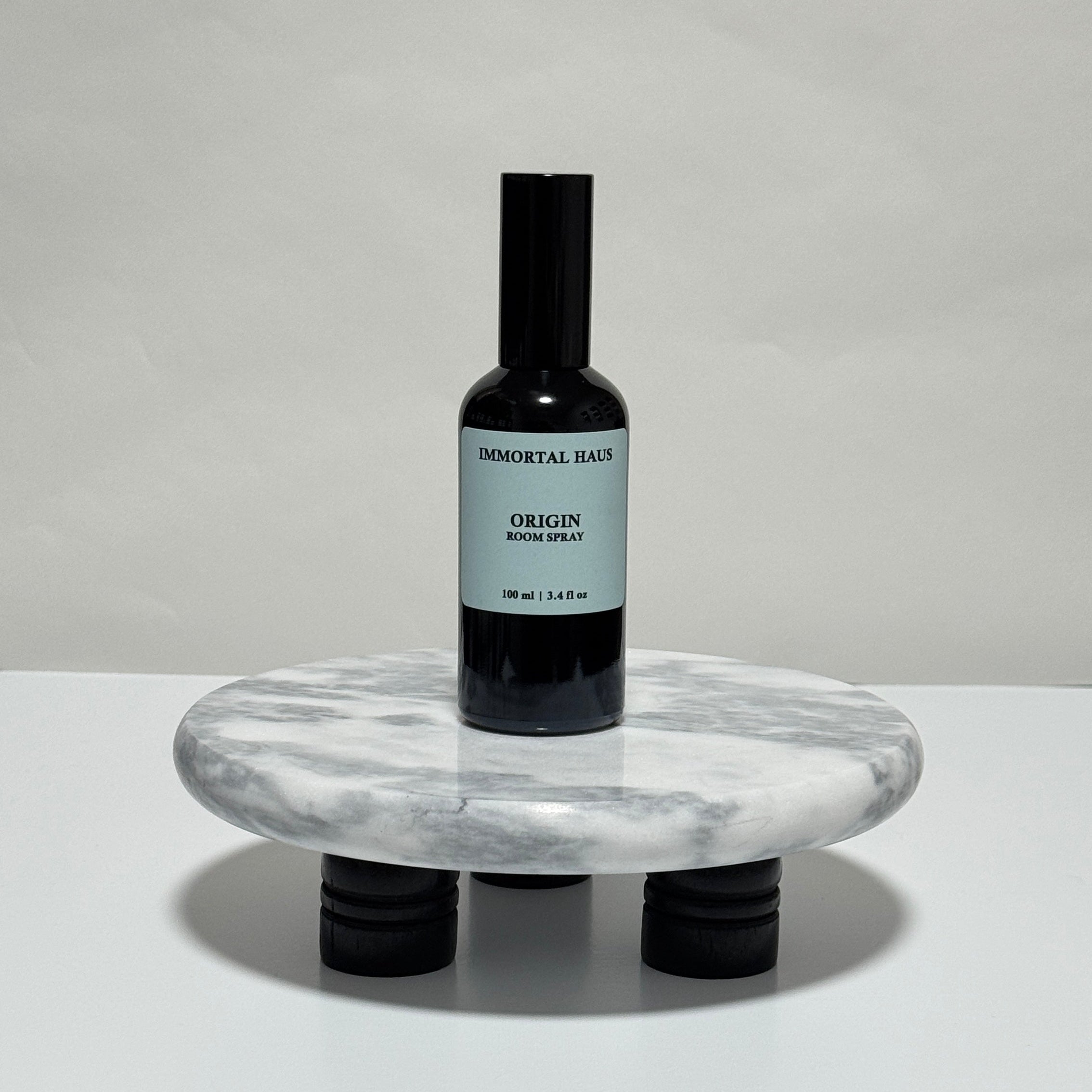Origin room and linen spray in black glass bottle, peppermint, eucalyptus, and coconut milk scent, 3.4oz