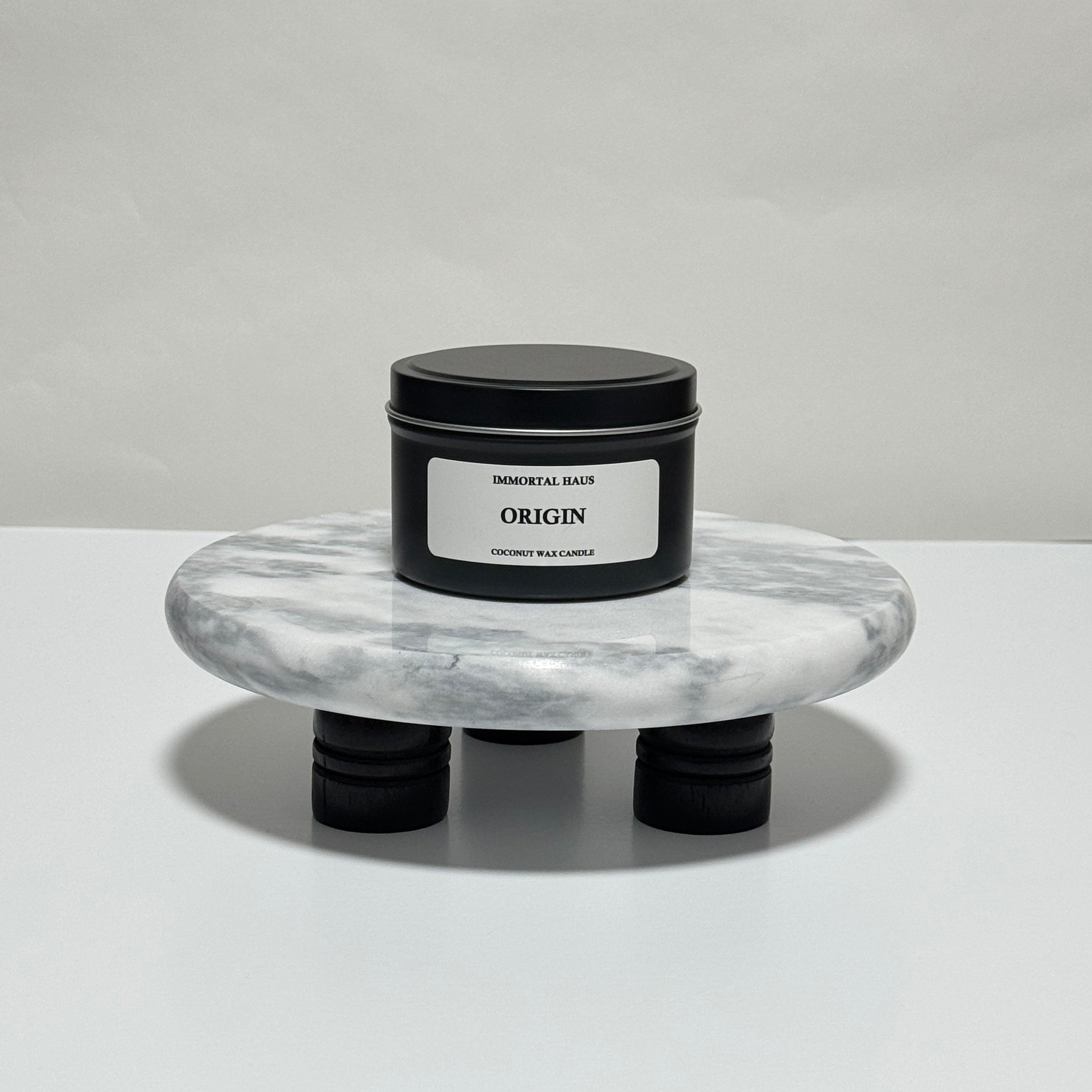 Origin travel candle in charcoal gray tin, peppermint and coconut milk scent, 6.3 oz single wick