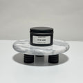 Oud Ame travel candle in charcoal gray tin, oud and amber scent, 6.3 oz single wick
