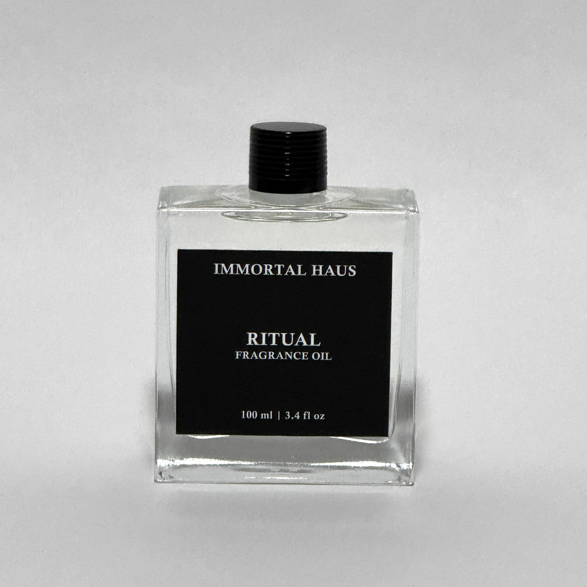 Ritual fragrance oil in glass bottle, rose water, hibiscus, and musk scent, for cold air diffusers