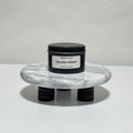 Salted Tonka travel candle in charcoal gray tin, sea salt and tonka bean scent, 6.3 oz single wick