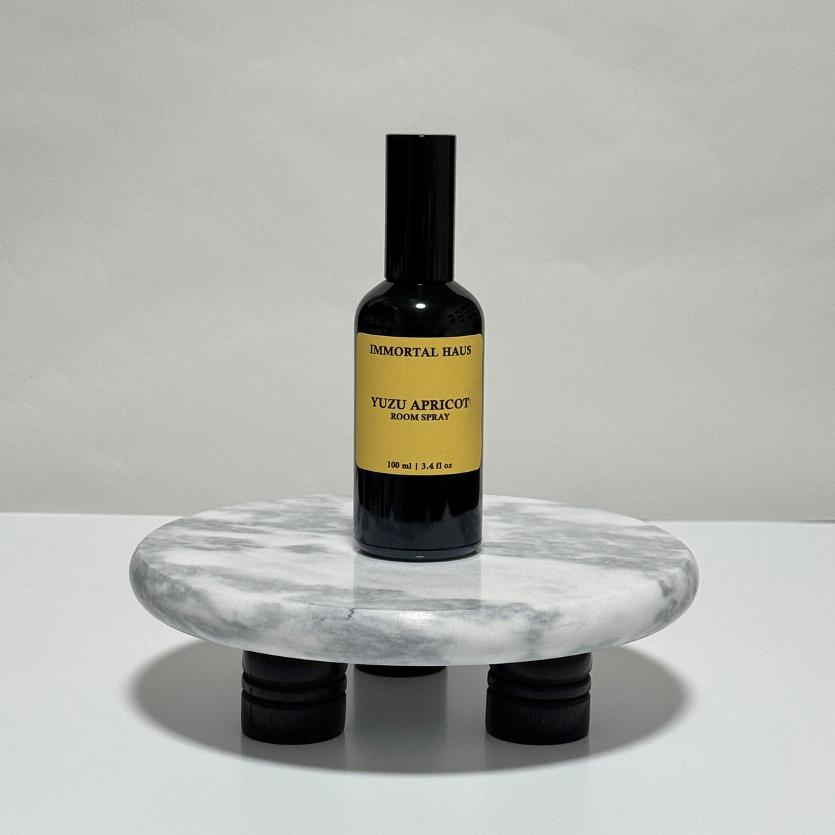 Yuzu Apricot room and linen spray in black glass bottle, yuzu, apricot, and hinoki scent, 3.4oz